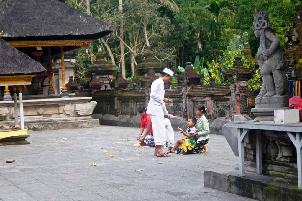 A local child receiving a blessing at the Pura Tirtha Empul Temple